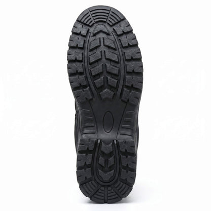 Close-up of a black safety boot sole with tread pattern on a white background
